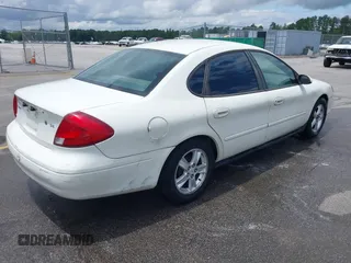 2003 Ford Taurus SE Standard with VIN 1FAFP53U13A192387, listed as a IAAI auction lot 42398723 with 247,077 mi miles and . Bid and sale history available at DreamBid. Image 4.