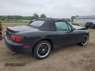 1999 Mazda MX-5 Miata with VIN JM1NB3531X0102616, listed as a Copart auction lot 59779415 with 194,494 mi miles and Salvage title. Bid and sale history available at DreamBid. Image 3.