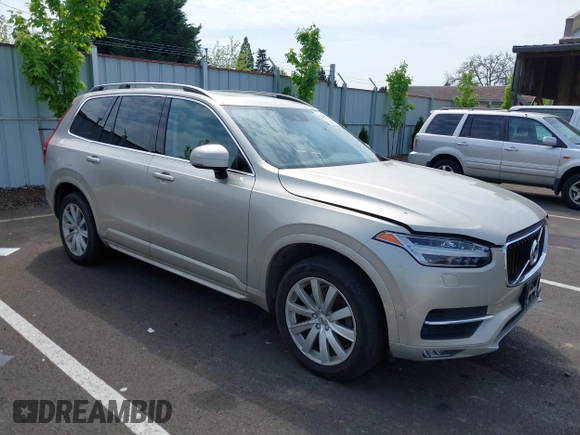 2016 Volvo XC90 T6 Momentum with VIN YV4A22PK7G1038750, listed as a IAAI auction lot 42128057 with 124,112 mi miles. Bid and sale history available at carsss.com. Image 1.