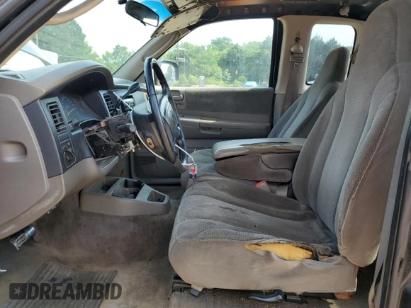 2001 Dodge Dakota z VIN 1B7GL22X81S204868, wystawiony jako Copart lot #57178895 z przebiegiem 298 667 mil mil oraz Szkoda całkowita • Salvage title. Historia ofert i sprzedaży dostępna na DreamBid. Obrazek 7.