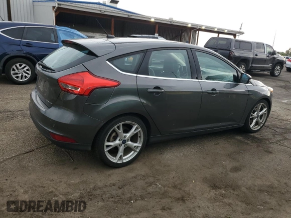 2016 Ford Focus Titanium z VIN 1FADP3N27GL329026, wystawiony jako Copart lot #60910475 z przebiegiem 98 794 mil mil oraz Szkoda całkowita • Salvage title. Historia ofert i sprzedaży dostępna na DreamBid. Obrazek 3.