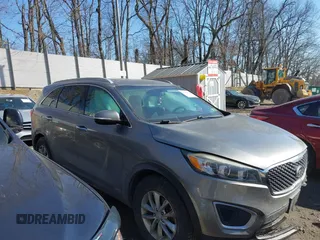 2016 Kia Sorento LX with VIN 5XYPGDA39GG061748, listed as a IAAI auction lot 41720011 with 124,084 mi miles. Bid and sale history available at carsss.com. Image 14.