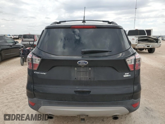 2017 Ford Escape SE with VIN 1FMCU9G93HUB66829, listed as a Copart auction lot 69093414 with 99,569 mi miles and Salvage Title. Bid and sale history available at carsss.com. Image 6.