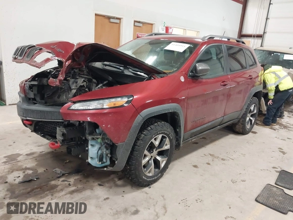 2015 Jeep Cherokee Trailhawk with VIN 1C4PJMBS7FW646577, listed as a IAAI auction lot 41404911 with 85,343 mi miles and . Bid and sale history available at DreamBid. Image 2.