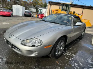 1999 Jaguar XK z VIN SAJGX2048XC041933, wystawiony jako Copart lot #44338125 z przebiegiem 67 133 mil mil oraz Tytuł czysty. Historia ofert i sprzedaży dostępna na DreamBid. Obrazek 2.