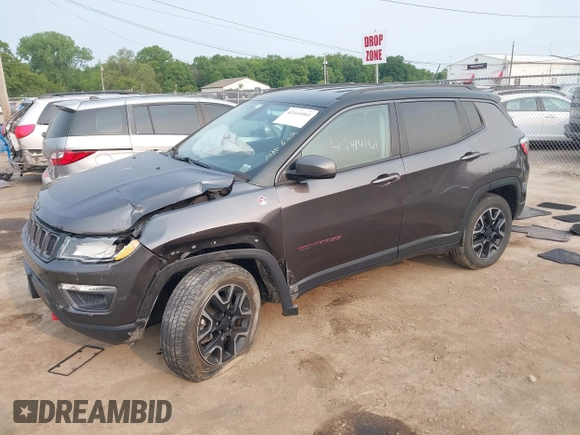 2019 Jeep Compass Trailhawk z VIN 3C4NJDDB9KT686048, wystawiony jako IAAI lot #42414161 z przebiegiem 92 683 mil mil oraz . Historia ofert i sprzedaży dostępna na DreamBid. Obrazek 2.