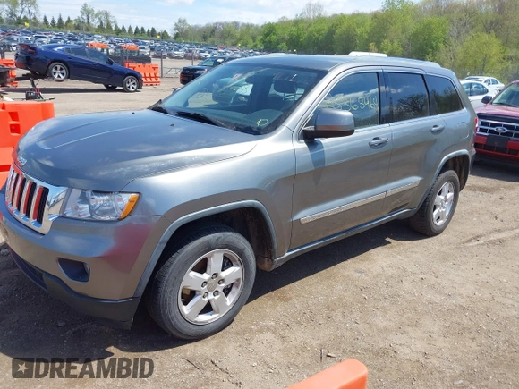 2011 Jeep Grand Cherokee Laredo with VIN 1J4RR4GGXBC587911, listed as a IAAI auction lot 42156885 with 178,999 mi miles and . Bid and sale history available at DreamBid. Image 2.