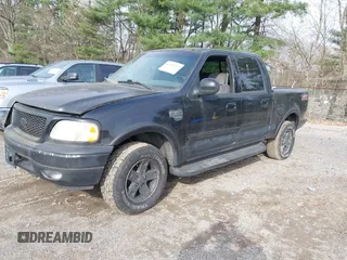 2002 Ford F-150 XLT with VIN 1FTRW08L12KB91777, listed as a IAAI auction lot 42007013 with 192,758 mi miles. Bid and sale history available at carsss.com. Image 2.