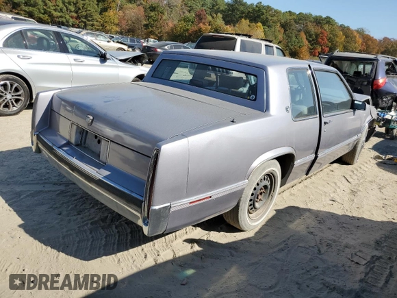 1990 Cadillac DeVille z VIN 1G6CD1339L4358825, wystawiony jako Copart lot #76901884 z przebiegiem 169 956 mil mil oraz Szkoda całkowita • Salvage title. Historia ofert i sprzedaży dostępna na DreamBid. Obrazek 3.