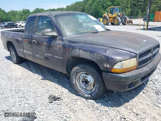 1998 Dodge Dakota SLT with VIN 1B7GL22X3WS569885, listed as a IAAI auction lot 42128994 with 1 mi miles. Bid and sale history available at carsss.com. Image 1.