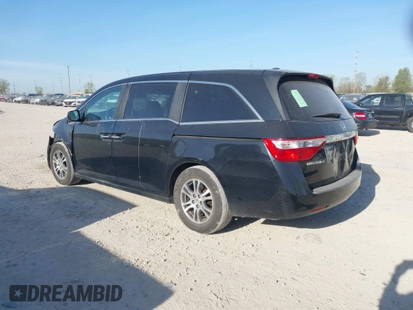 2012 Honda Odyssey EX-L with VIN 5FNRL5H6XCB016801, listed as a IAAI auction lot 42112141 with 164,671 mi miles and . Bid and sale history available at carsss.com. Image 3.
