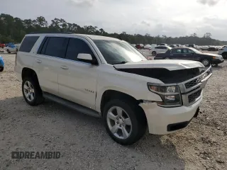 2015 Chevrolet Tahoe LT with VIN 1GNSCBKC9FR220574, listed as a Copart auction lot 54788555 with 244,491 mi miles and Salvage title. Bid and sale history available at DreamBid. Image 4.