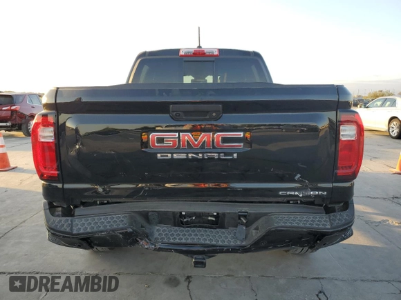 2023 GMC Canyon 4WD Denali with VIN 1GTP6FEK8P1164692, listed as a Copart auction lot 77033234 with 5,644 mi miles and Salvage Title. Bid and sale history available at carsss.com. Image 6.