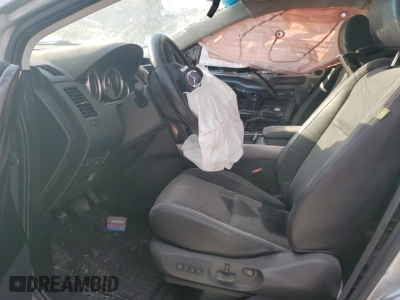 2015 Mazda CX-9 Grand Touring z VIN JM3TB2DA5F0468215, wystawiony jako Copart lot #53961975 z przebiegiem Nie podano mil oraz Szkoda całkowita • Salvage title. Historia ofert i sprzedaży dostępna na DreamBid. Obrazek 7.