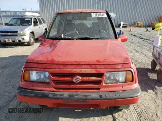 1998 Suzuki Sidekick JS z VIN 2S3TE02V3W6406072, wystawiony jako Copart lot #75855544 z przebiegiem 120 359 mil mil oraz Szkody całkowita. Historia ofert i sprzedaży dostępna na DreamBid. Obrazek 5.