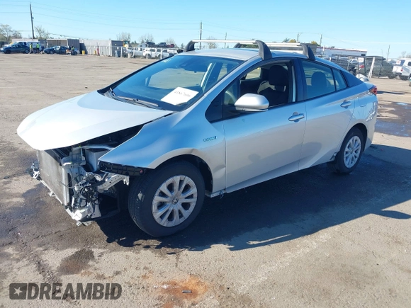 2021 Toyota Prius L Eco with VIN JTDKAMFU5M3130478, listed as a IAAI auction lot 41867606 with 52,223 mi miles. Bid and sale history available at carsss.com. Image 18.