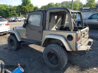 2003 Jeep Wrangler Sahara with VIN 1J4FA59S83P318057, listed as a Copart auction lot 58781495 with 102,571 mi miles and Clean title. Bid and sale history available at DreamBid. Image 2.