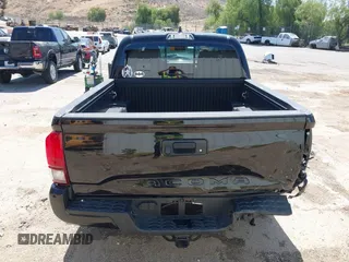 2023 Toyota Tacoma SR with VIN 3TMCZ5AN1PM654572, listed as a IAAI auction lot 42312575 with 14,111 mi miles and . Bid and sale history available at DreamBid. Image 16.