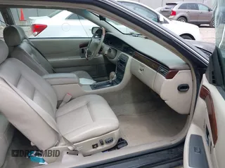 2002 Cadillac Eldorado ESC z VIN 1G6EL12Y82B105241, wystawiony jako IAAI lot #42241609 z przebiegiem 90 442 mil mil oraz . Historia ofert i sprzedaży dostępna na DreamBid. Obrazek 5.