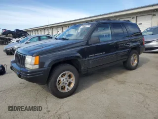 1998 Jeep Grand Cherokee Limited with VIN 1J4GZ78Y0WC140588, listed as a Copart auction lot 49522445 with 62,195 mi miles and Salvage Title. Bid and sale history available at carsss.com. Image 1.