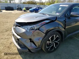 2019 Toyota C-HR XLE z VIN NMTKHMBX4KR084471, wystawiony jako Copart lot #52575985 z przebiegiem 54 578 mil mil oraz Szkoda całkowita • Salvage title. Historia ofert i sprzedaży dostępna na DreamBid. Obrazek 11.