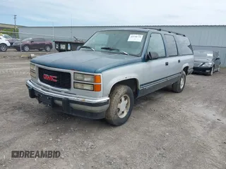 1994 GMC Suburban z VIN 1GKEC16K2RJ750376, wystawiony jako IAAI lot #42278734 z przebiegiem 185 403 mil mil oraz . Historia ofert i sprzedaży dostępna na DreamBid. Obrazek 2.