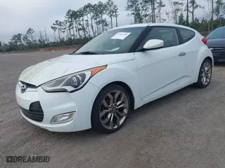 2014 Hyundai Veloster with VIN KMHTC6ADXEU213073, listed as a IAAI auction lot 41551346 with 130,549 mi miles. Bid and sale history available at carsss.com. Image 2.