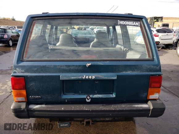 1996 Jeep Cherokee SE z VIN 1J4FJ28S6TL184205, wystawiony jako Copart lot #77558034 z przebiegiem 195 000 mil mil oraz Tytuł czysty. Historia ofert i sprzedaży dostępna na DreamBid. Obrazek 6.