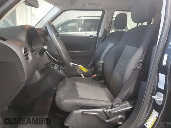 2015 Jeep Patriot Latitude with VIN 1C4NJRFB0FD125811, listed as a Copart auction lot 56658815 with 169,500 mi miles and Clean title. Bid and sale history available at DreamBid. Image 7.