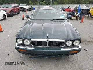 1999 Jaguar XJ with VIN SAJHX1044XC865054, listed as a Copart auction lot 57825325 with 71,145 mi miles and Clean title. Bid and sale history available at DreamBid. Image 5.
