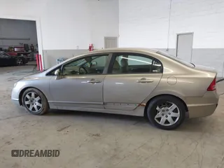 2006 Honda Civic LX z VIN 1HGFA16556L005459, wystawiony jako IAAI lot #41940768 z przebiegiem 178 595 mil mil oraz . Historia ofert i sprzedaży dostępna na DreamBid. Obrazek 14.