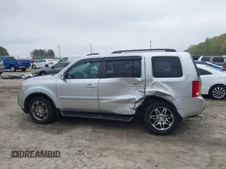 2014 Honda Pilot Touring with VIN 5FNYF4H91EB011934, listed as a IAAI auction lot 41929415 with 227,343 mi miles and . Bid and sale history available at DreamBid. Image 14.