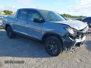 2024 Honda Ridgeline Sport z VIN 5FPYK3F18RB032599, wystawiony jako IAAI lot #41109930 z przebiegiem 4 085 mil mil oraz . Historia ofert i sprzedaży dostępna na DreamBid. Obrazek 1.
