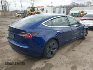 2019 Tesla Model 3 Mid Range with VIN 5YJ3E1EA5KF299589, listed as a IAAI auction lot 41709733 with 50,256 mi miles and . Bid and sale history available at DreamBid. Image 4.