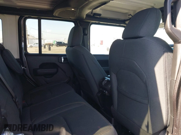 2024 Jeep Wrangler Sport S with VIN 1C4RJXN61RW192386, listed as a IAAI auction lot 42001810 with 7,426 mi miles and . Bid and sale history available at DreamBid. Image 8.