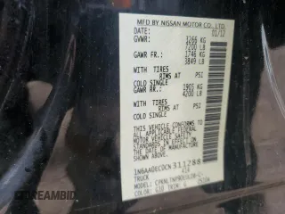 2012 Nissan Titan SV z VIN 1N6AA0EC0CN311288, wystawiony jako Copart lot #56845405 z przebiegiem 71 180 mil mil oraz Szkoda całkowita • Salvage title. Historia ofert i sprzedaży dostępna na DreamBid. Obrazek 13.