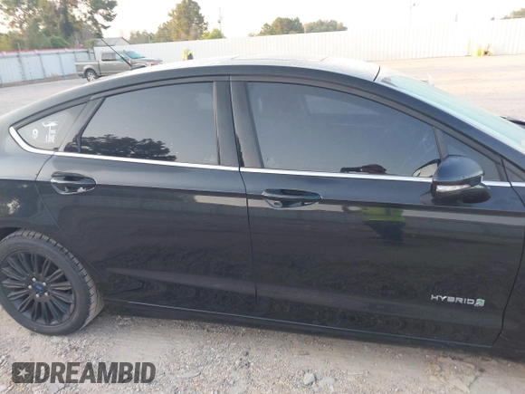 2015 Ford Fusion SE Hybrid with VIN 3FA6P0LU8FR310626, listed as a IAAI auction lot 40048581 with 124,086 mi miles and . Bid and sale history available at DreamBid. Image 13.