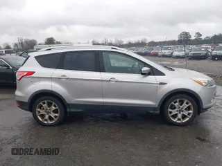 2016 Ford Escape Titanium with VIN 1FMCU0JX7GUB25573, listed as a IAAI auction lot 41871980 with 157,525 mi miles. Bid and sale history available at carsss.com. Image 13.