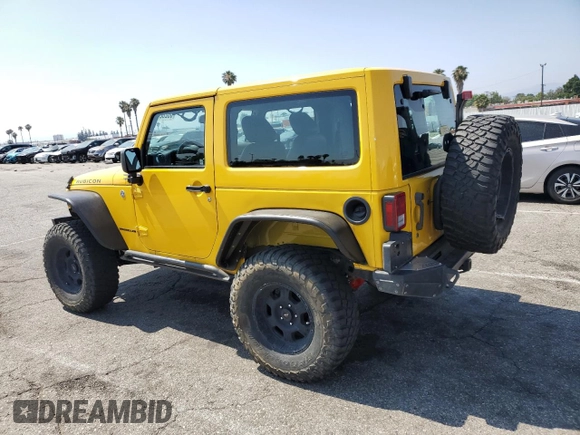 2015 Jeep Wrangler Rubicon Hard Rock with VIN 1C4BJWCG6FL568665, listed as a Copart auction lot 60282155 with 107,773 mi miles and Salvage title. Bid and sale history available at DreamBid. Image 2.