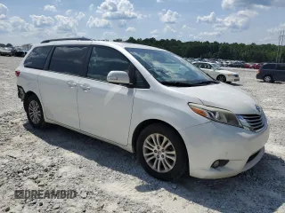 2015 Toyota Sienna XLE with VIN 5TDYK3DC0FS543020, listed as a Copart auction lot 61479225 with 221,814 mi miles and Salvage title. Bid and sale history available at DreamBid. Image 4.