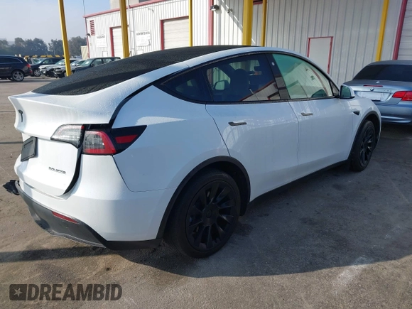 2023 Tesla Model Y Long Range with VIN 7SAYGAEE7PF766735, listed as a IAAI auction lot 41626651 with 21,983 mi miles. Bid and sale history available at carsss.com. Image 4.