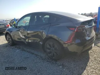 2024 Tesla Model Y z VIN 7SAYGDED2RF114150, wystawiony jako Copart lot #54754585 z przebiegiem 7 924 mil mil oraz Szkoda całkowita • Salvage title. Historia ofert i sprzedaży dostępna na DreamBid. Obrazek 2.