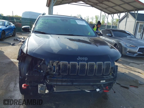 2022 Jeep Cherokee Trailhawk with VIN 1C4PJMBX1ND533715, listed as a IAAI auction lot 42041057 with 65,487 mi miles and . Bid and sale history available at DreamBid. Image 13.