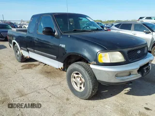 1997 Ford F-150 XL with VIN 1FTDX18W6VKD46643, listed as a IAAI auction lot 42111129 with 107,025 mi miles. Bid and sale history available at carsss.com. Image 1.