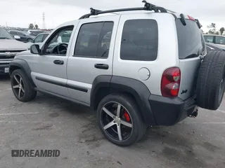 2007 Jeep Liberty Sport with VIN 1J4GK48K67W511199, listed as a IAAI auction lot 42079058 with 156,699 mi miles. Bid and sale history available at carsss.com. Image 3.