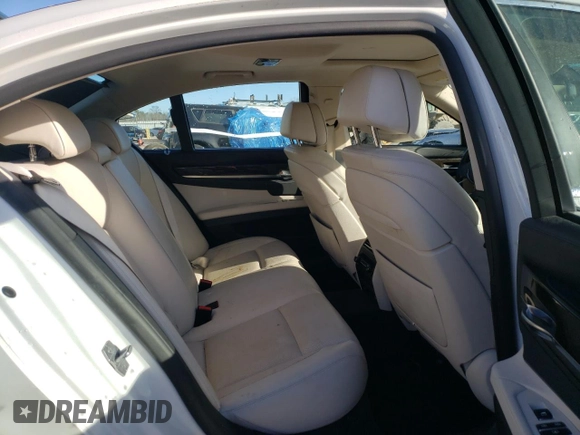 2013 BMW 7 Series 750i with VIN WBAYA8C55DC996693, listed as a Copart auction lot 80233423 with 140,925 mi miles and Salvage Title. Bid and sale history available at DreamBid. Image 10.