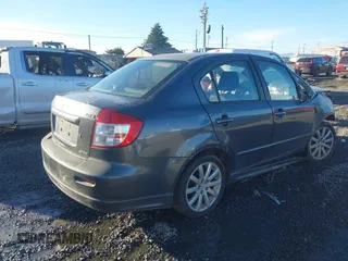 2010 Suzuki SX4 with VIN JS2YC5A40A6300053, listed as a IAAI auction lot 41392061 with 114,863 mi miles and . Bid and sale history available at DreamBid. Image 4.