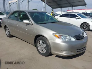 2002 Toyota Camry XLE z VIN 4T1BF32K22U540173, wystawiony jako IAAI lot #42015450 z przebiegiem 176 322 mil mil oraz . Historia ofert i sprzedaży dostępna na DreamBid. Obrazek 1.