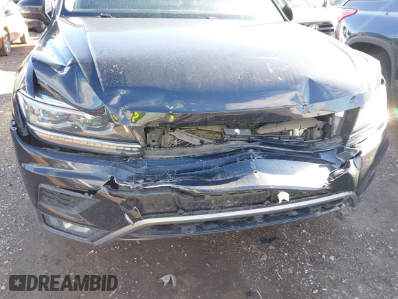 2018 Volkswagen Tiguan SEL Premium with VIN 3VV5B7AX8JM073475, listed as a IAAI auction lot 41816194 with 65,838 mi miles and . Bid and sale history available at DreamBid. Image 6.