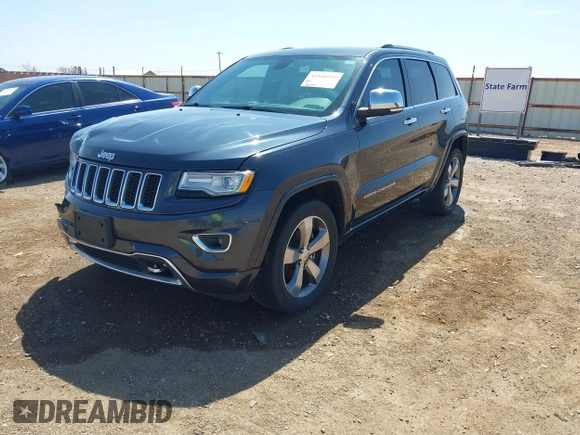2015 Jeep Grand Cherokee Overland with VIN 1C4RJECG3FC635327, listed as a IAAI auction lot 41910559 with 118,519 mi miles and . Bid and sale history available at DreamBid. Image 17.